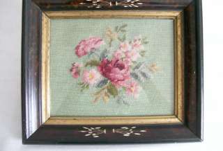   frame.Design is on dark green background with dark pink, rose, and