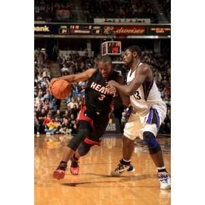 Miami Heat v Sacramento Kings Dwayne Wade and Tyreke Evans by Ezra 