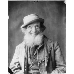  Dapper old man with white beard,big smile,wearing hat 
