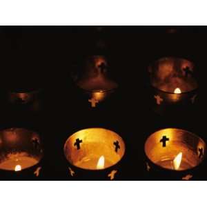 Votives Burn in a Darkened Church in Santa Fe Premium Photographic 