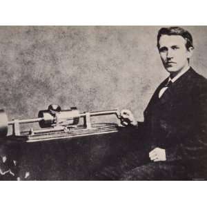  Thomas A. Edison Sitting by His Invention, the Phonograph 