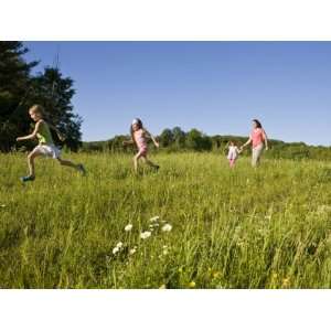  Hikeers walk in a field in Sabins Pasture, Montpelier 