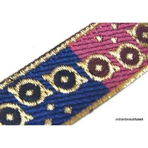 Jacquard ribbon trim. Metallic gold flowers on royal blue