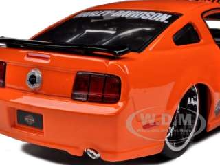   scale diecast car model of 2006 ford mustang gt harley davidson orange