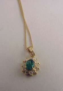 14 karat gold earrings with man made emerald & 14 karat gold necklace 