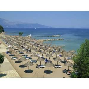 Beach Umbrellas on Coast Near Dassia, on the Island of Corfu, Ionian 