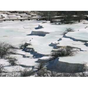 Colourful Pools of Calcite Deposit Frozen at Huanglong National Park 