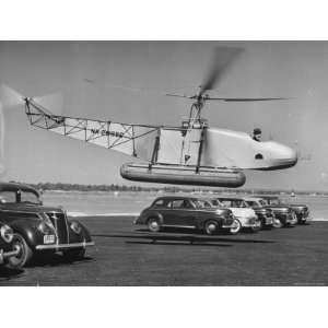  Igor Sikorsky Taking Off in Helicopter from Parking Lot 