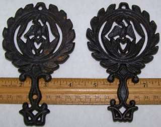 You will be purchasing 2 black cast iron vintage trivets. 5 1/4 eagle 